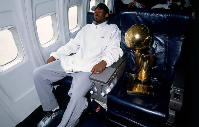 Kobe sleeping with NBA championship on the Lakers team plane
