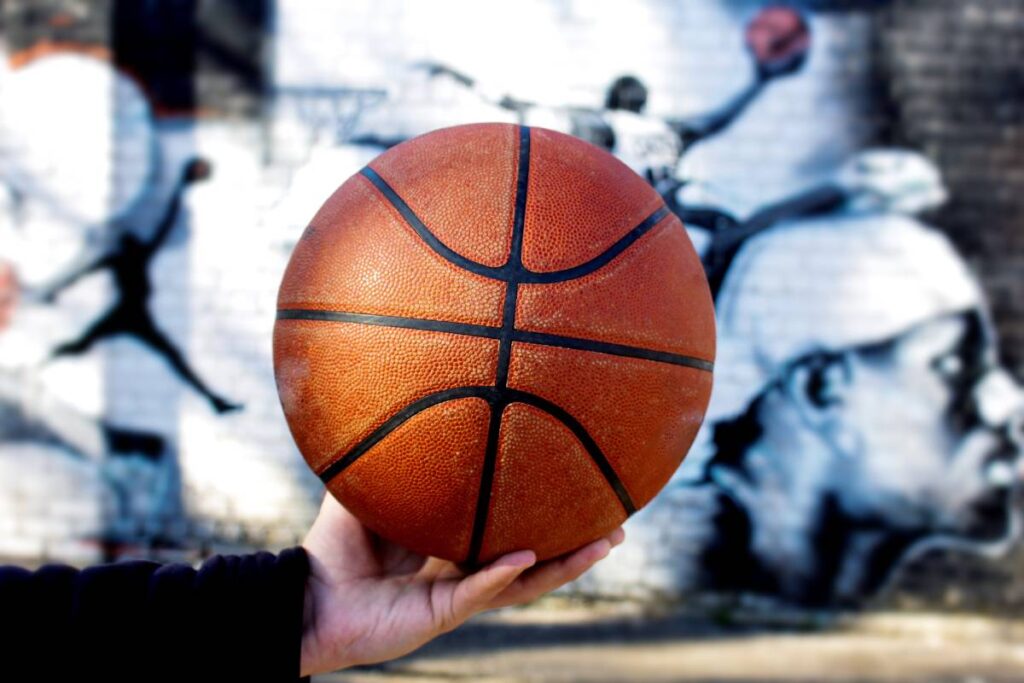 Holding a basketball